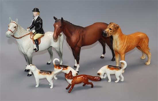 A Beswick lady horse rider, a fox and three hounds, a dog and a horse (7)